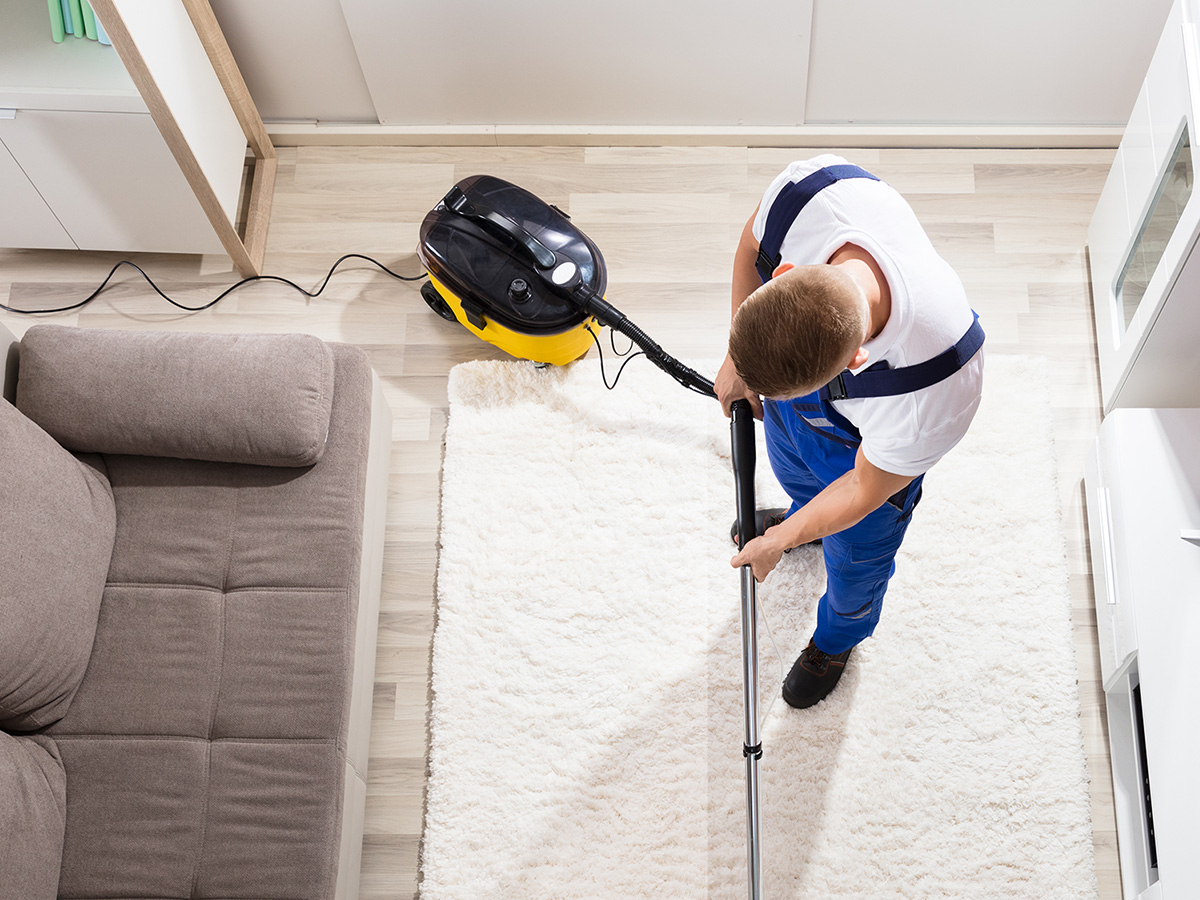 Image of a cleaner vaccuming