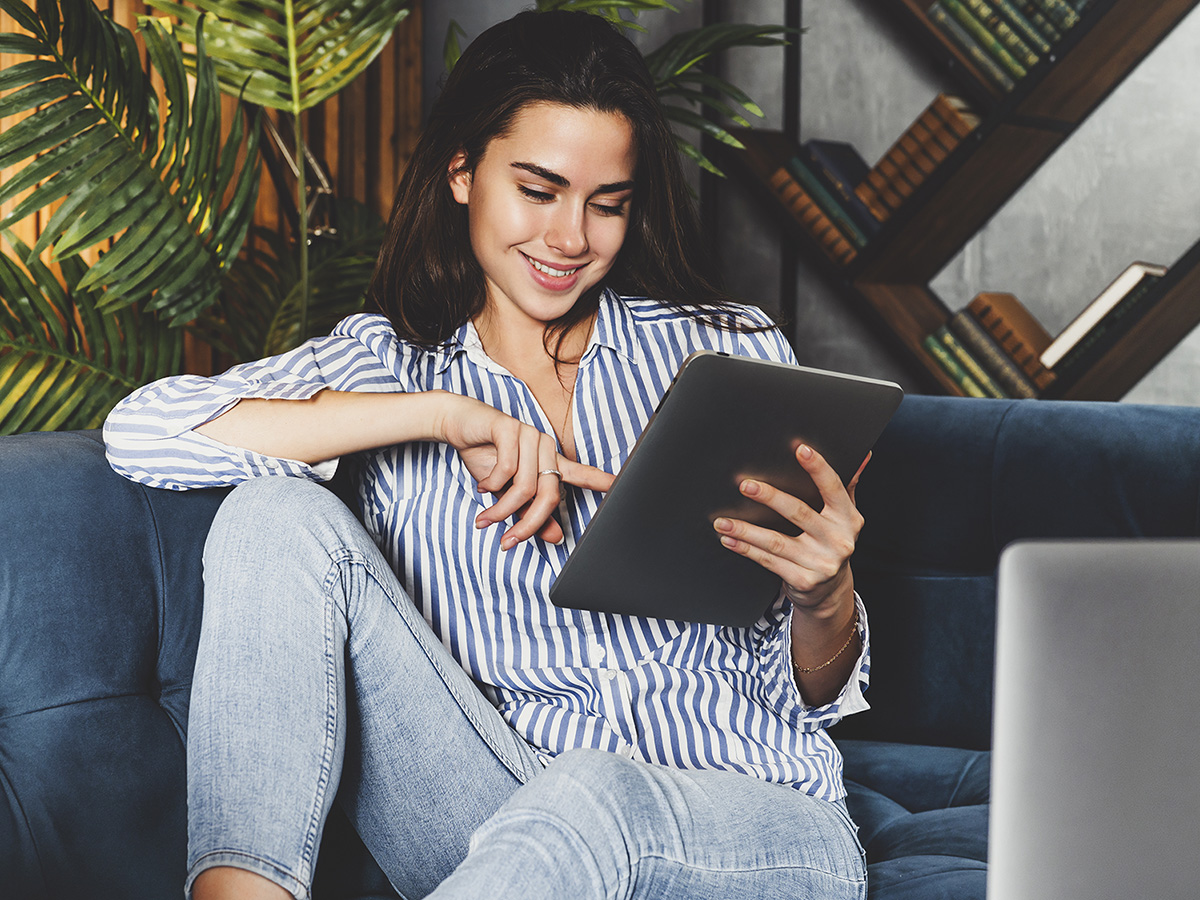 Image of a woman relaxing on the couch