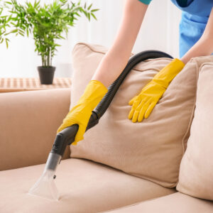 image of someone cleaning a couch