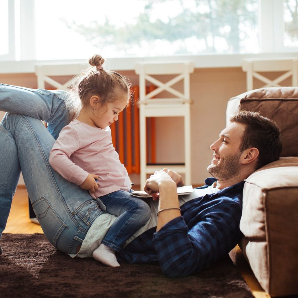 An image of a dad playing with his kid.