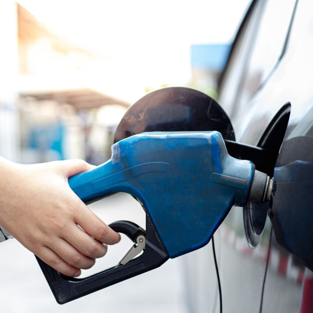 Woman fueling up their car