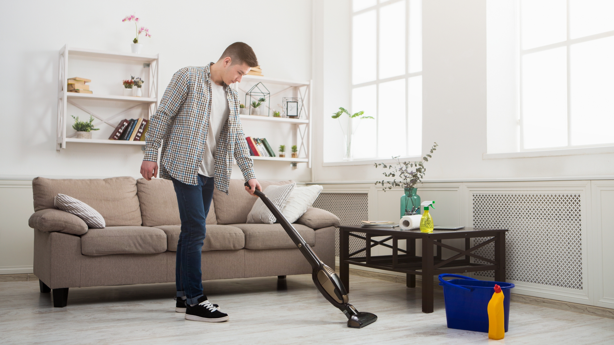 img of a man vaccuming