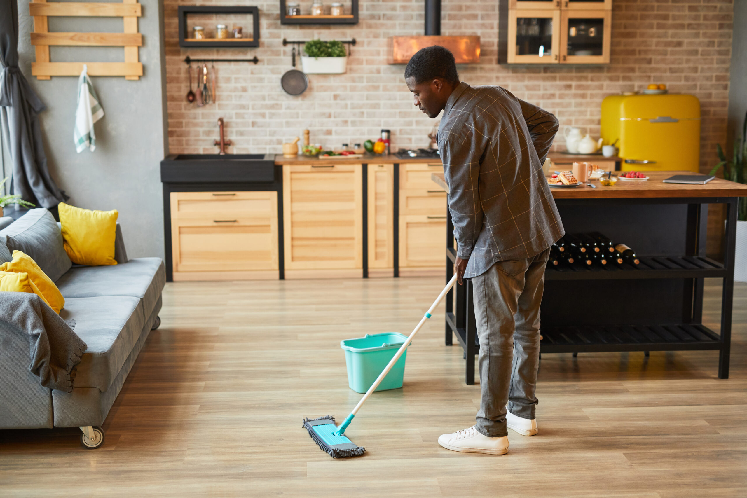 img of someone cleaning floors