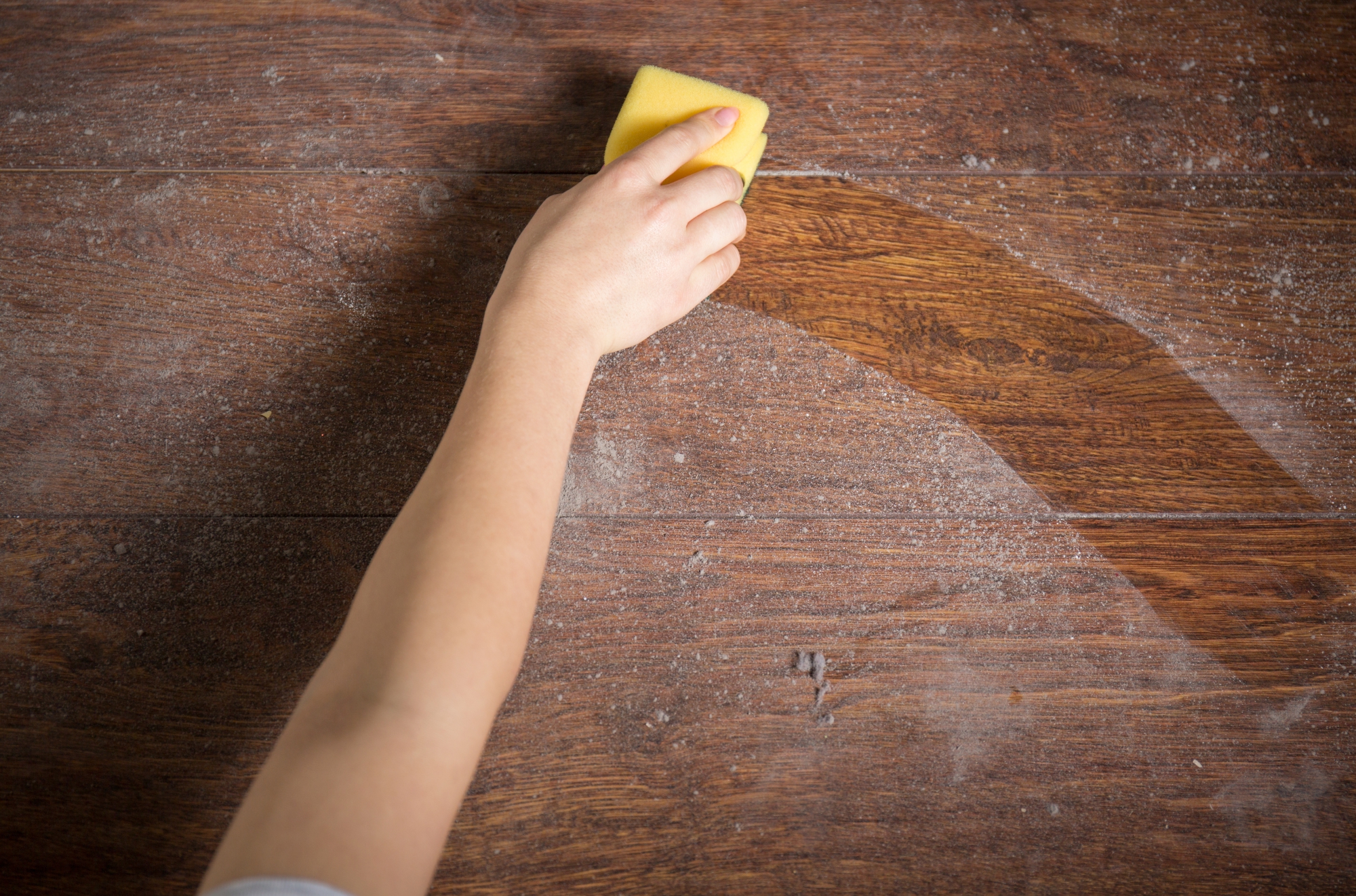 img of someone dusting wood floors