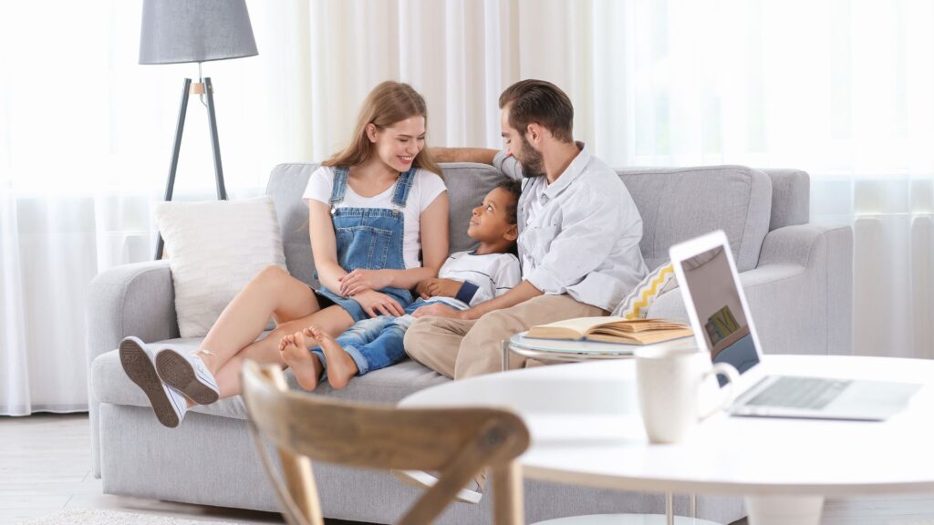 happy family sitting in their clean living room