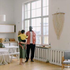 family standing in their clean house