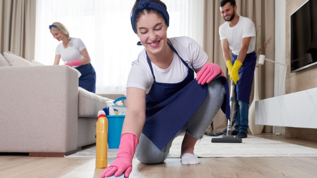Professional house cleaners cleaning a home.