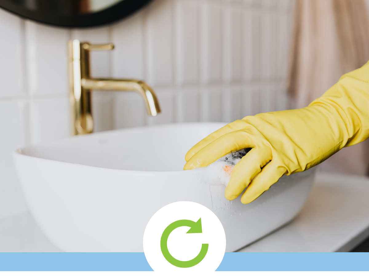 Image - closeup scrubbing a bathroom sink. Icon - revolving circle arrow