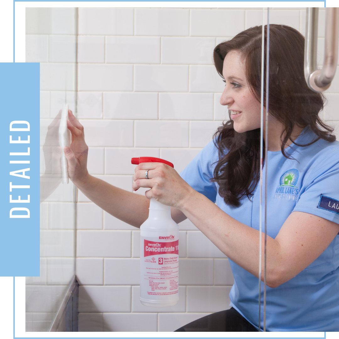 Image - April Lane's Cleaning crew member cleaning shower glass door. Text - Detailed